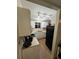 The kitchen features white appliances and cabinets, and wood-look vinyl flooring at 4024 Canal Rd, Lake Wales, FL 33898