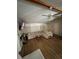 Open living room area with vaulted ceiling, ceiling fan, new flooring, and comfortable furniture at 4024 Canal Rd, Lake Wales, FL 33898