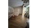 Open living room area with vaulted ceiling, new flooring, comfortable couch, and hallway to the kitchen at 4024 Canal Rd, Lake Wales, FL 33898