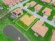 An aerial view showcases the home's proximity to a tranquil pond and lush landscaping at 4073 Sable Loop Dr, Lake Wales, FL 33859