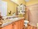 Bathroom with a shower and sink, and including a decorative cabinet and decorative tile counters at 4073 Sable Loop Dr, Lake Wales, FL 33859