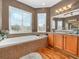 Elegant bathroom featuring a large soaking tub and a spacious vanity at 4073 Sable Loop Dr, Lake Wales, FL 33859