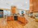 Kitchen featuring wood cabinets, tile countertops, stainless steel sink, and recessed lighting at 4073 Sable Loop Dr, Lake Wales, FL 33859
