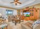 Cozy living room with comfortable seating, a ceiling fan, and a view of the outdoors at 4073 Sable Loop Dr, Lake Wales, FL 33859