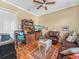 Relaxing living room featuring a charming area rug and decorative wooden shelving at 4073 Sable Loop Dr, Lake Wales, FL 33859