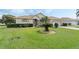 Charming single-story home with a well-manicured lawn, mature landscaping, and a two-car garage at 415 Ruby Lake Pl, Winter Haven, FL 33884