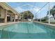Enjoy this private pool with a screened enclosure and well-maintained landscaping at 415 Ruby Lake Pl, Winter Haven, FL 33884