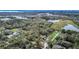 Wide aerial view shows the home's proximity to natural lakes and wooded land at 428 Garrett Ridge Ct, Winter Haven, FL 33880