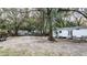 Spacious backyard with mature trees, providing shade and privacy for outdoor enjoyment at 428 Garrett Ridge Ct, Winter Haven, FL 33880