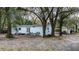 Back exterior view of home with patio at 428 Garrett Ridge Ct, Winter Haven, FL 33880
