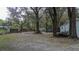 View of the large treed backyard of the home at 428 Garrett Ridge Ct, Winter Haven, FL 33880