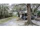 View of a boat and covered trailer stored in the backyard at 428 Garrett Ridge Ct, Winter Haven, FL 33880