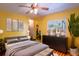 This is a cheerful bedroom with nice natural light, light wood floors and closet at 428 Garrett Ridge Ct, Winter Haven, FL 33880