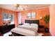 Modern bedroom with stylish decor, featuring a comfortable bed and hardwood floors at 428 Garrett Ridge Ct, Winter Haven, FL 33880