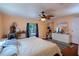 Cozy bedroom featuring a ceiling fan, and natural light from the window at 428 Garrett Ridge Ct, Winter Haven, FL 33880