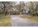 View of a long driveway leading to a property in a rural area at 428 Garrett Ridge Ct, Winter Haven, FL 33880