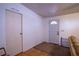 Bright entry area with two doors, wood floors, and white walls at 428 Garrett Ridge Ct, Winter Haven, FL 33880