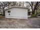 Side view of a well-maintained single-story home with screened porch at 428 Garrett Ridge Ct, Winter Haven, FL 33880