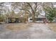 Spacious front yard with a covered carport and shed at 428 Garrett Ridge Ct, Winter Haven, FL 33880