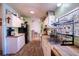 This kitchen has lots of storage with white cabinets, butcher block countertops and new wood flooring at 428 Garrett Ridge Ct, Winter Haven, FL 33880