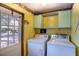 Well-equipped laundry room with washer and dryer units at 428 Garrett Ridge Ct, Winter Haven, FL 33880