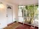 This outdoor enclosed porch with a white door and a tropical potted plant adds curb appeal at 428 Garrett Ridge Ct, Winter Haven, FL 33880