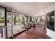 Relaxing screened porch featuring outdoor seating with a table, great for enjoying the outdoors at 428 Garrett Ridge Ct, Winter Haven, FL 33880