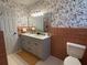 Bathroom features a shower with glass door, vanity with dual sinks and a toilet at 4909 Fleetwood St, Lake Wales, FL 33859