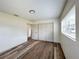 Bright bedroom features wood-look floors and a double-door closet for ample storage at 4909 Fleetwood St, Lake Wales, FL 33859