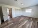 Bedroom with laminate flooring, natural light, and closet storage at 4909 Fleetwood St, Lake Wales, FL 33859