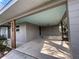 Spacious covered carport features wooden support beams, blue painted ceiling, and access to side entry at 4909 Fleetwood St, Lake Wales, FL 33859