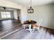 Inviting dining area featuring modern light fixture and view of the living area at 4909 Fleetwood St, Lake Wales, FL 33859