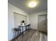 Dining area featuring wood-look flooring, modern table set and a nearby entry door at 4909 Fleetwood St, Lake Wales, FL 33859