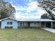 Charming single-story home featuring a well-manicured lawn, and a convenient carport at 4909 Fleetwood St, Lake Wales, FL 33859