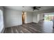 Open-concept living room with plenty of light and view to dining area with backyard access at 4909 Fleetwood St, Lake Wales, FL 33859