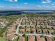 A beautiful aerial view of a home in a Lake Ashton community, featuring a scenic lake view and mature landscaping at 5304 Nicklaus Dr, Winter Haven, FL 33884