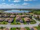 An aerial view highlights the lake and surrounding residential area, showcasing the area's scenic charm at 5304 Nicklaus Dr, Winter Haven, FL 33884