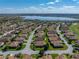 A beautiful aerial view of a home in a Lake Ashton community, featuring a scenic lake and well-maintained landscaping at 5304 Nicklaus Dr, Winter Haven, FL 33884