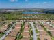 An aerial view of a home in Lake Ashton, showcasing the community with mature trees and beautiful landscaping at 5304 Nicklaus Dr, Winter Haven, FL 33884