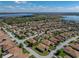 A beautiful aerial view of a home in a Lake Ashton community, featuring scenic lake views and well-maintained landscaping at 5304 Nicklaus Dr, Winter Haven, FL 33884