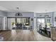 Dining area with hardwood floors, sliding door access to the patio, and modern chandelier at 5304 Nicklaus Dr, Winter Haven, FL 33884