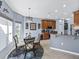 Charming breakfast nook with stylish light fixture, round table and kitchen views at 5304 Nicklaus Dr, Winter Haven, FL 33884