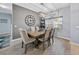 Cozy dining room with stylish decor, including a rustic chandelier and comfortable seating at 5304 Nicklaus Dr, Winter Haven, FL 33884