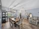 Bright dining area with modern lighting, elegant decor, and wood flooring, perfect for entertaining at 5304 Nicklaus Dr, Winter Haven, FL 33884