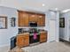 Kitchen showcasing wooden cabinets, stainless steel appliances, and tiled floors at 5304 Nicklaus Dr, Winter Haven, FL 33884