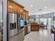 Modern kitchen featuring stainless steel appliances, wooden cabinetry, and a breakfast bar at 5304 Nicklaus Dr, Winter Haven, FL 33884