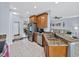 Bright eat-in kitchen featuring granite counters, stainless appliances, and a breakfast bar at 5304 Nicklaus Dr, Winter Haven, FL 33884