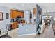 Eat-in kitchen featuring wooden cabinets, granite countertops, and stainless steel appliances at 5304 Nicklaus Dr, Winter Haven, FL 33884