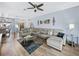 Inviting living room showcasing a comfortable sectional sofa, stylish decor, and ample natural light at 5304 Nicklaus Dr, Winter Haven, FL 33884