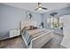 Relaxing main bedroom with neutral color palette, ceiling fan, and ample natural light at 5304 Nicklaus Dr, Winter Haven, FL 33884